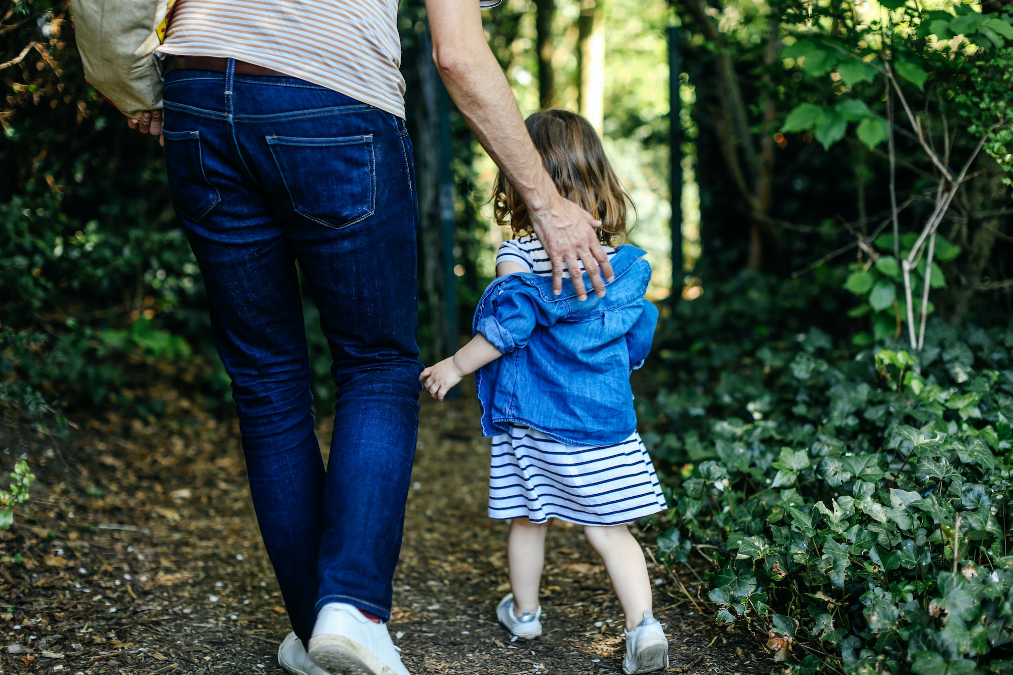 Father and little girl enjoying nature walk